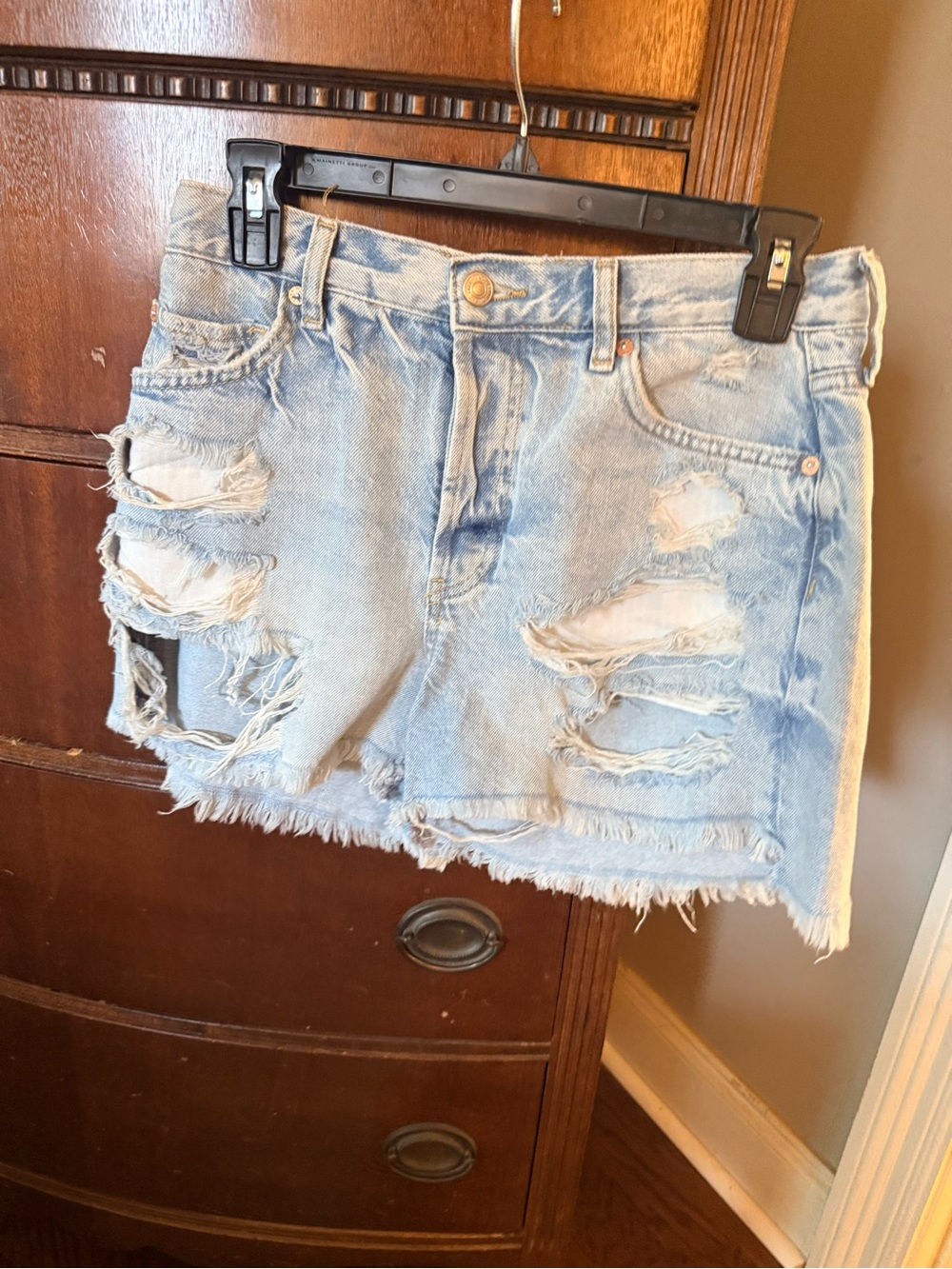 Distressed Light Wash Denim shorts. We the free